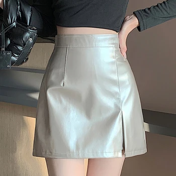 Осенняя женская короткая мини-юбка трапециевидной формы с разрезом и высокой талией, женская Корейская винтажная повседневная однотонная юбка из искусственной кожи, облегающая женская юбка